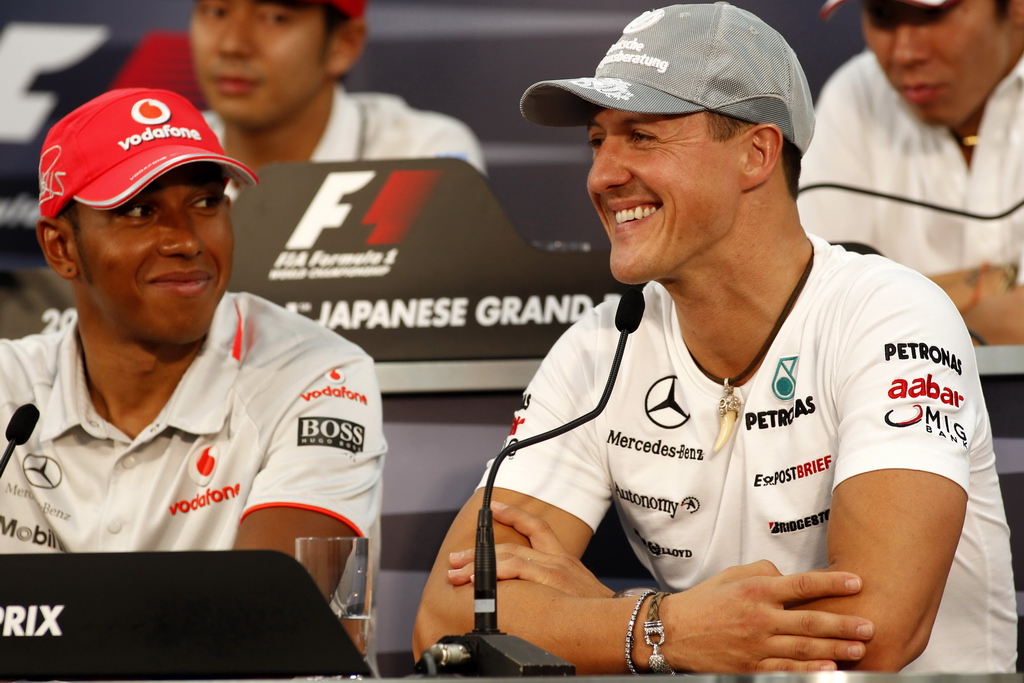 Podaří se Lewisovi Hamiltonovi (vlevo) do konce své kariéry v počtu titulů překonat Michaela Schumachera?